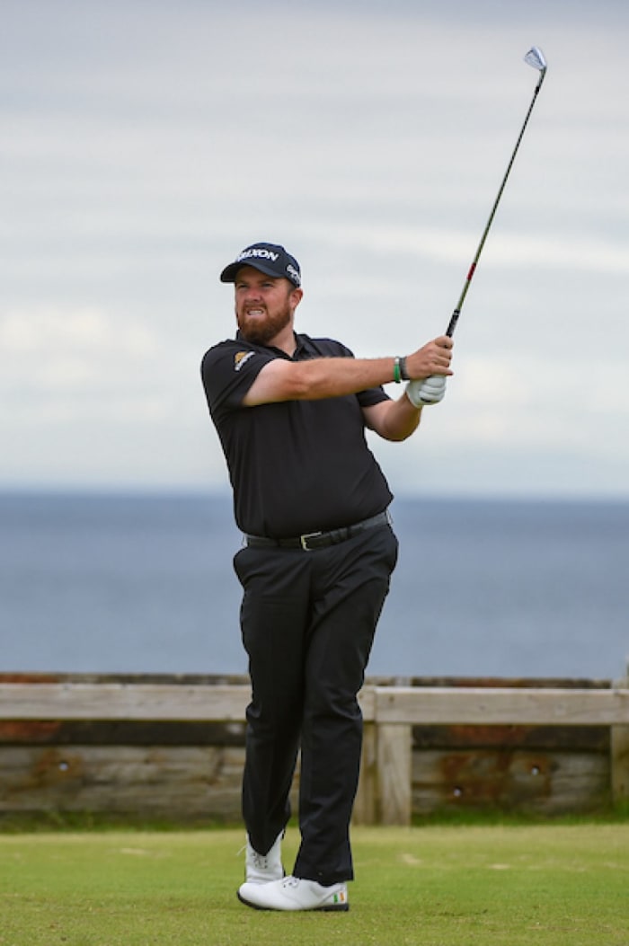 Shane Lowry, watching his tee shot on the 6th hole Friday at Royal Portrush, holds a share of the British Open lead.